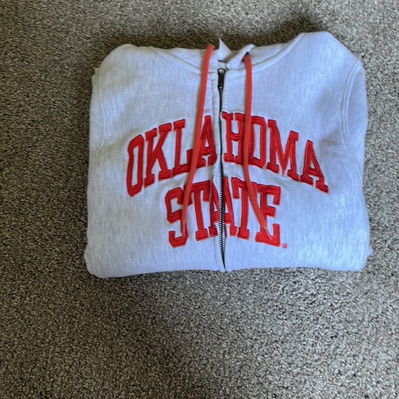 This is an orange and grey zip up hoodie that has never been worn. - Picture 4 of 4